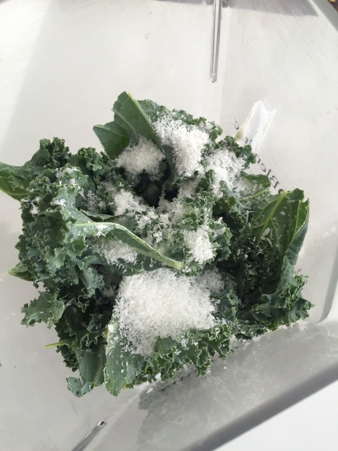 Kale smoothie with coconut flakes
