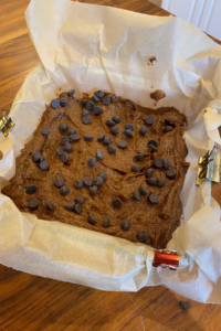 binder clips on parchment paper with sweet potato brownies
